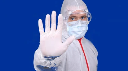 Wearing medical personal protective equipment