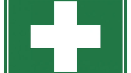 A white cross on a green background is the internationally accepted symbol for first aid.