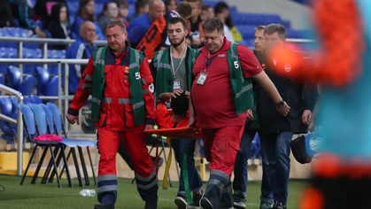 Here, a Ukrainian football player is stretchered off after experiencing a nasty concussion.