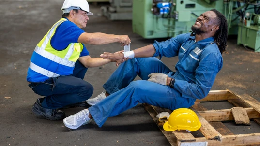 Industrial accident workers providing first aid
